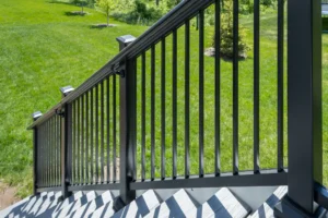 Image shows close up of Aria Stair Rail in bronze color